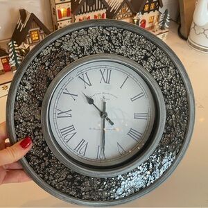 Gorgeous mirrored wall clock. Runs and looks as brand new.